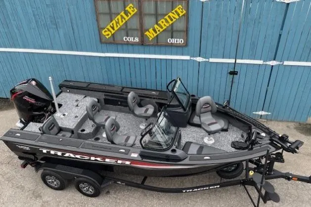 Slide: The Image of 2026 Tracker Targa V-19 Combo boat on trailer, parked outside Sizzle Marine, Ohio. - 5