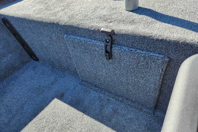 Slide: The Image of 2026 Tracker Bass Tracker Classic XL boat interior with carpeted storage compartment. - 64