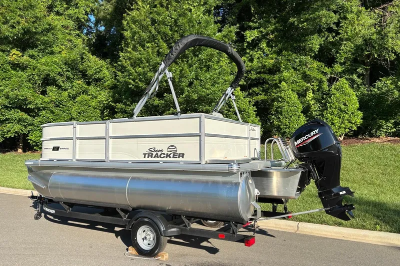 Slide: The Image of 2026 Sun Tracker Party Barge 16 DLX pontoon boat with Mercury outboard motor. - 4