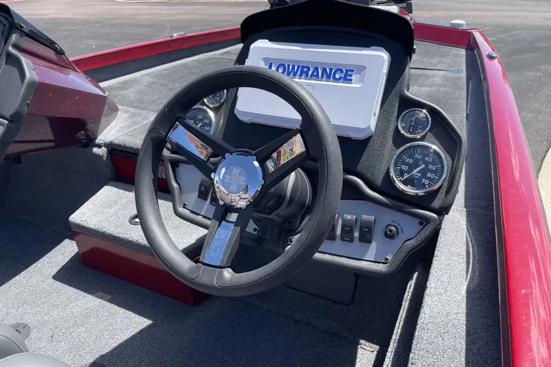 Slide: The Image of 2026 Ranger RT188P boat dashboard with steering wheel, gauges, and Lowrance display. - 4