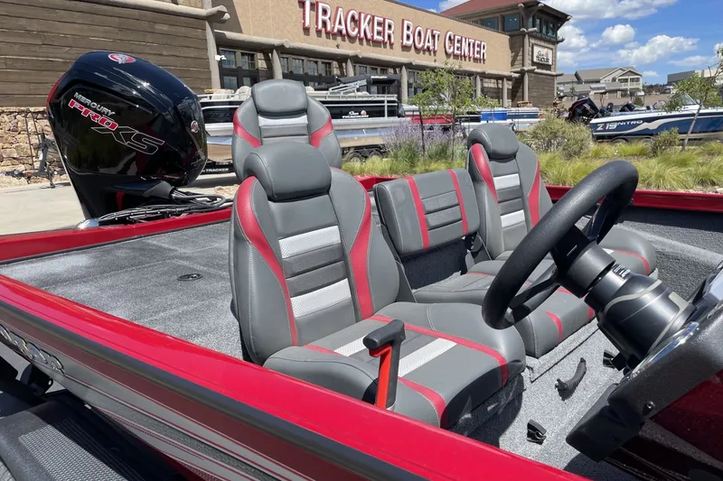 Slide: The Image of 2026 Ranger RT188P boat interior with red and gray seats at Tracker Boat Center. - 8
