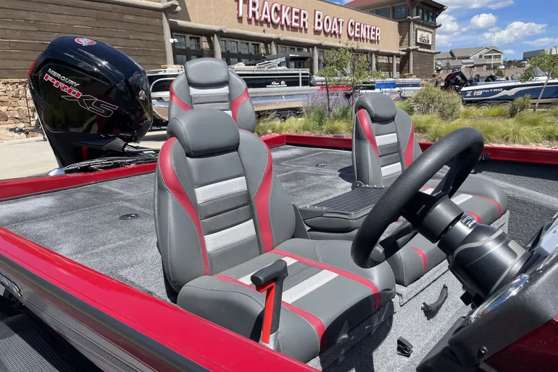 Slide: The Image of 2026 Ranger RT188P boat interior with gray and red seats at Tracker Boat Center. - 3