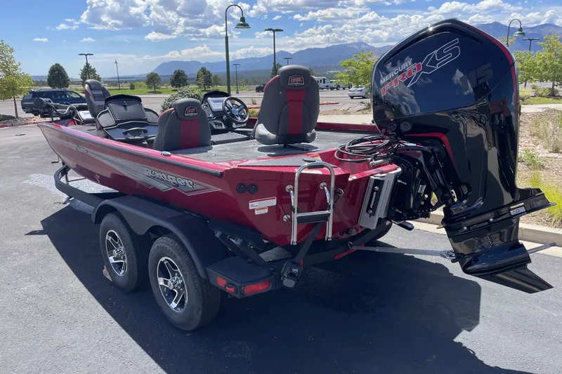 Slide: The Image of 2026 Ranger RT188P boat with Mercury Pro XS engine, parked outdoors on a sunny day. - 2