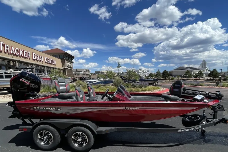 Slide: The Image of 2026 Ranger RT188P boat at Tracker Boat Center under a clear blue sky. - 7