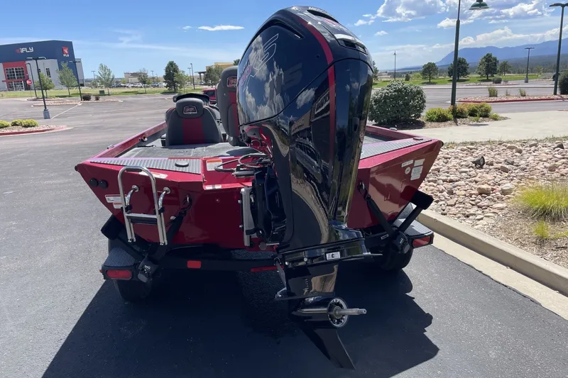 Slide: The Image of 2026 Ranger RT188P boat with powerful outboard motor in a parking lot. - 5