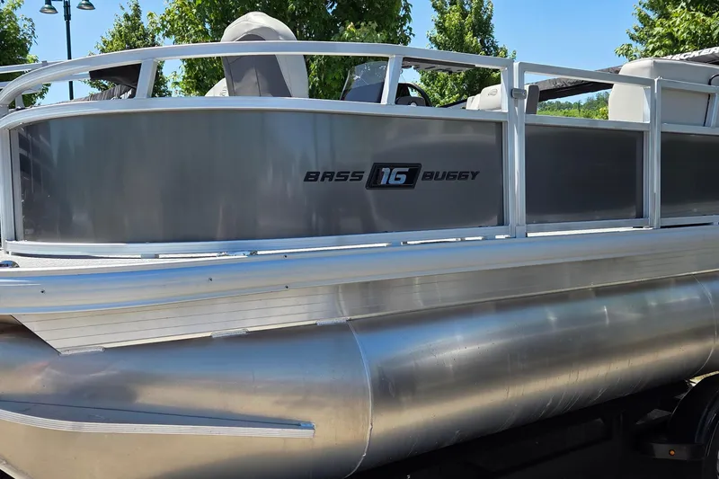 The Image of 2026 Sun Tracker Bass Buggy 16 XL Select pontoon boat, side view with logo. - 0