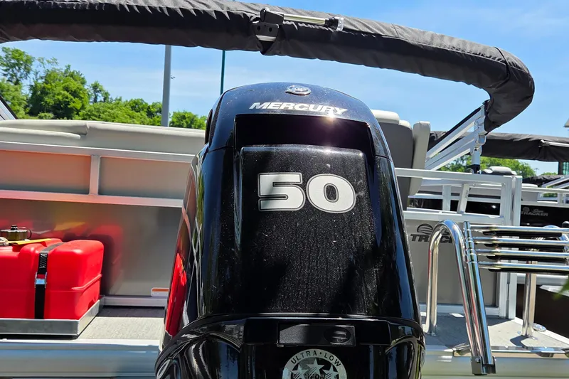 Slide: The Image of 2026 Sun Tracker Bass Buggy 16 XL Select with Mercury 50 engine, outdoor setting. - 4