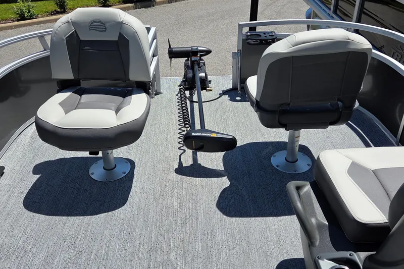 Slide: The Image of 2026 Sun Tracker Bass Buggy 16 XL Select boat interior with seating and trolling motor. - 5