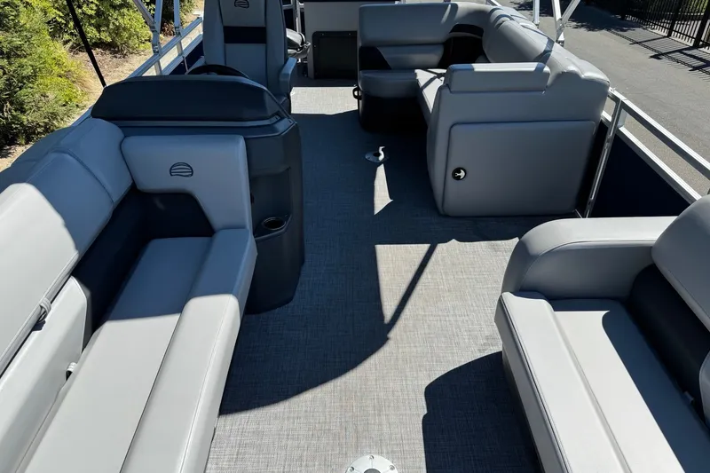 Slide: The Image of 2026 Sun Tracker SportFish 22 DLX pontoon boat interior with spacious seating and modern design. - 5