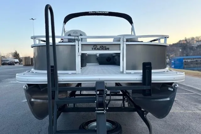Slide: The Image of 2026 Sun Tracker Bass Buggy 16 XL Select pontoon boat on trailer, rear view. - 112