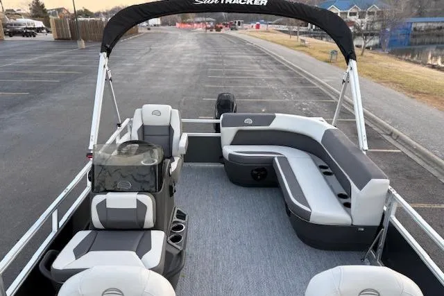 Slide: The Image of 2026 Sun Tracker Bass Buggy 16 XL Select pontoon boat with spacious seating and canopy. - 114