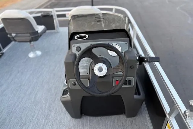 Slide: The Image of 2026 Sun Tracker Bass Buggy 16 XL Select pontoon boat steering console. - 115