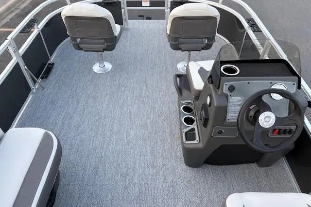 Slide: The Image of 2026 Sun Tracker Bass Buggy 16 XL Select pontoon boat interior with seating and steering console. - 118