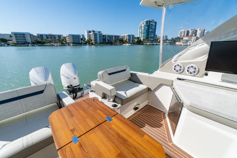 Slide: The Image of 2023 Tiara Yachts 34 LX on calm waters with modern amenities. - 24