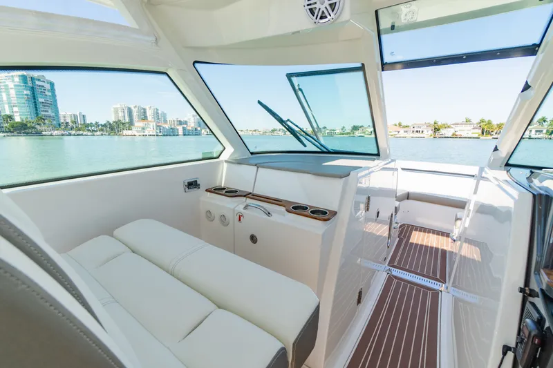 Slide: The Image of Interior of 2023 Tiara Yachts 34 LX with waterfront view. - 45