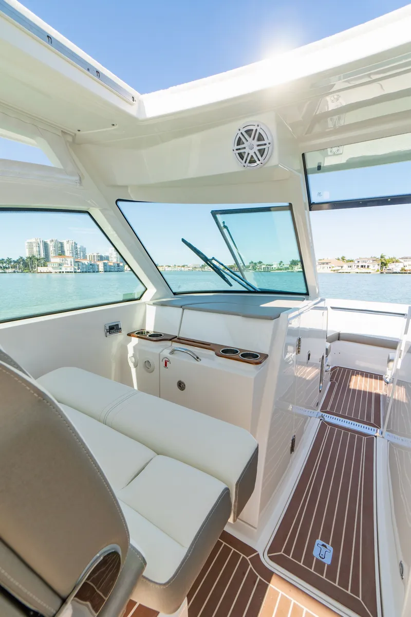 Slide: The Image of Interior of 2023 Tiara Yachts 34 LX with waterfront view. - 46