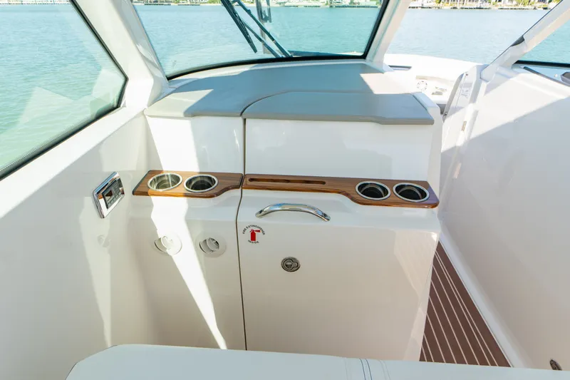 Slide: The Image of Interior of 2023 Tiara Yachts 34 LX with cup holders. - 47