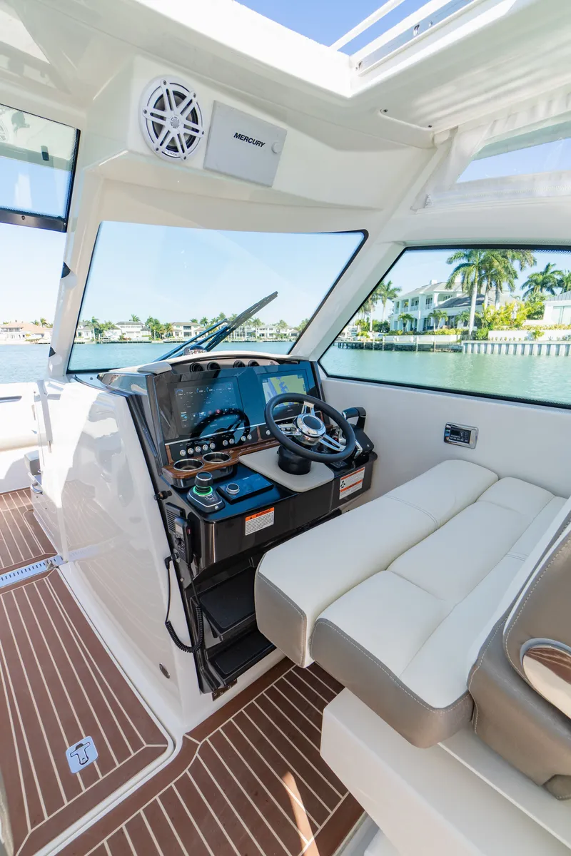 Slide: The Image of Interior of 2023 Tiara Yachts 34 LX with modern helm station. - 48