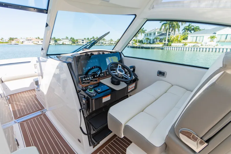Slide: The Image of Interior of 2023 Tiara Yachts 34 LX with helm console. - 49