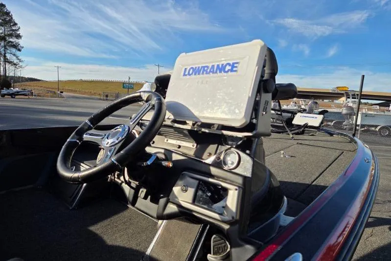 Slide: The Image of 2020 Nitro Z21 boat dashboard with Lowrance navigation system under clear blue sky. - 10