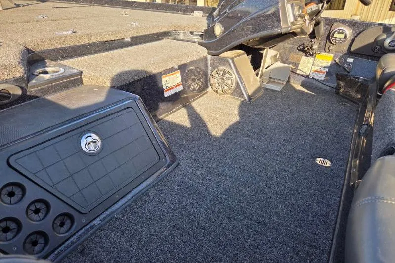 Slide: The Image of 2020 Nitro Z21 boat interior with carpeted deck and control panel. - 11