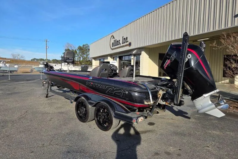 Slide: The Image of 2020 Nitro Z21 boat with powerful engine parked outside a building. - 2
