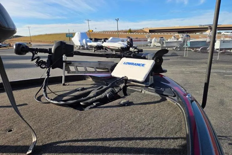 Slide: The Image of 2020 Nitro Z21 boat with Lowrance fishfinder and trolling motor in a parking lot. - 8