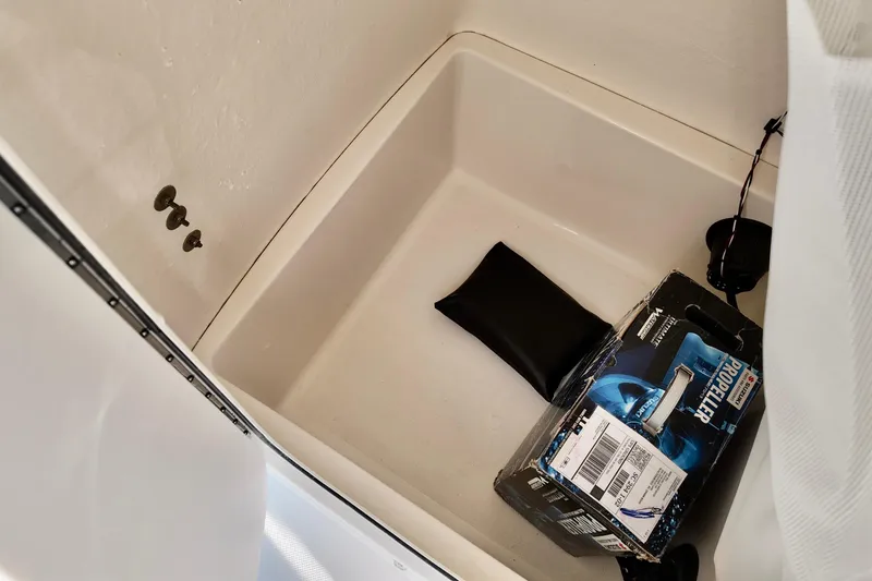 Slide: The Image of Storage compartment in 2026 Bulls Bay 230 Center Console boat with propeller box and accessories. - 13
