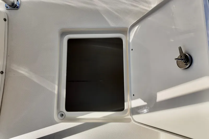 Slide: The Image of Open storage compartment on 2026 Bulls Bay 230 Center Console boat. - 14