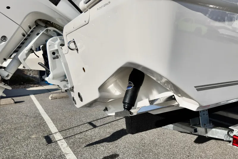 Slide: The Image of 2026 Bulls Bay 230 Center Console boat on trailer, showing engine and hull details. - 16