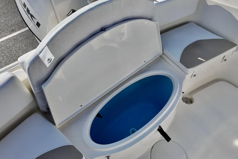 Slide: The Image of 2026 Bulls Bay 230 Center Console boat with open storage compartment. - 7