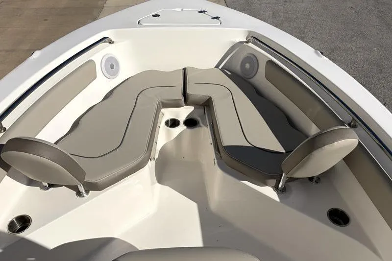 Slide: The Image of 2024 Key West 203 FS boat interior with beige seating and cup holders. - 18