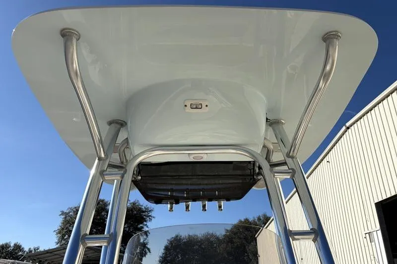 Slide: The Image of 2024 Key West 203 FS boat T-top with stainless steel supports under clear blue sky. - 22