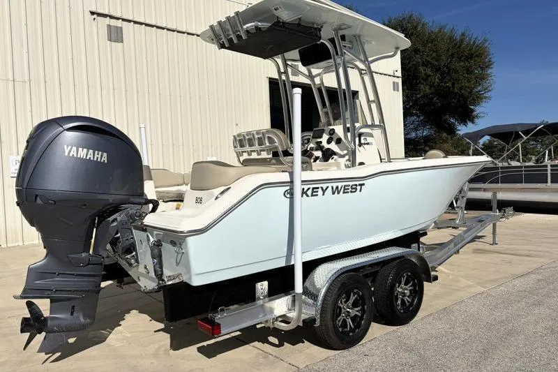 Slide: The Image of 2024 Key West 203 FS boat with Yamaha engine on a trailer. - 3