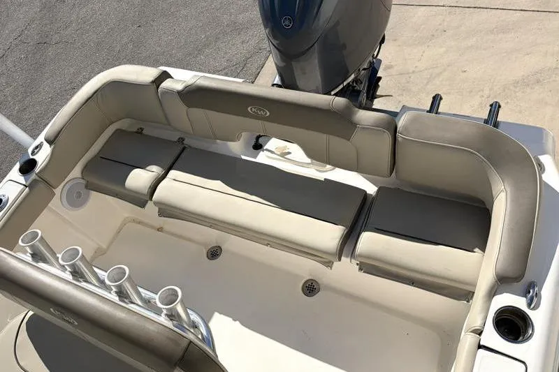Slide: The Image of 2024 Key West 203 FS boat interior with cushioned seating and rod holders. - 30