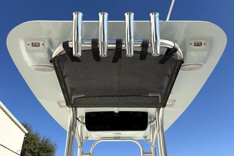 Slide: The Image of 2024 Key West 203 FS boat T-top with rod holders against clear blue sky. - 33