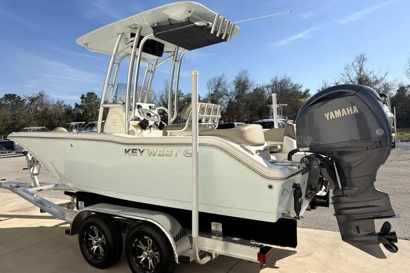 Slide: The Image of 2024 Key West 203 FS boat with Yamaha engine on trailer, outdoors. - 6