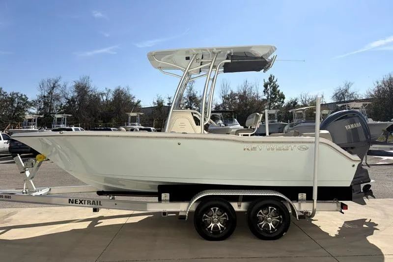 Slide: The Image of 2024 Key West 203 FS boat on trailer, side view, sunny day. - 7