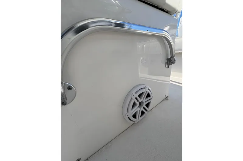 Slide: The Image of 2011 Regulator 28 Forward Seating boat interior with speaker and metal handrail. - 23