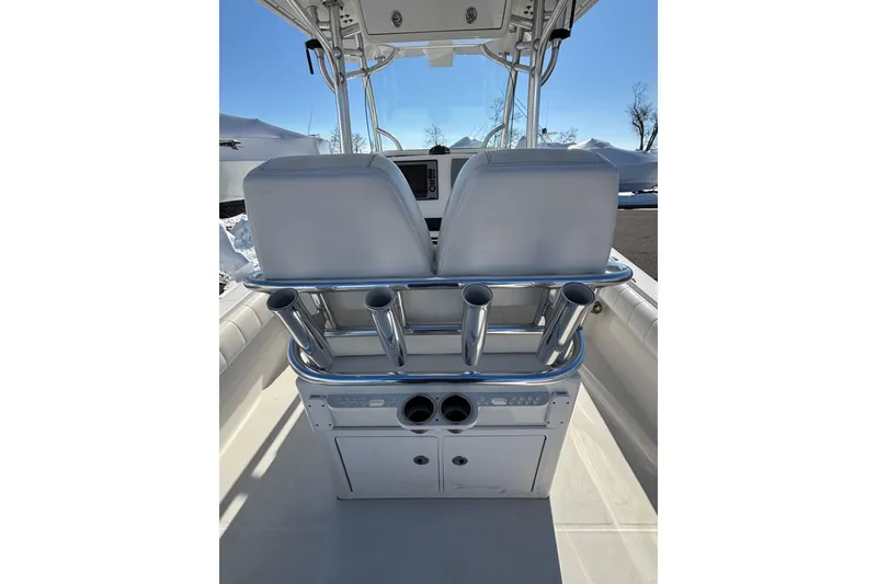 Slide: The Image of 2011 Regulator 28 Forward Seating boat interior with dual seats and rod holders. - 33
