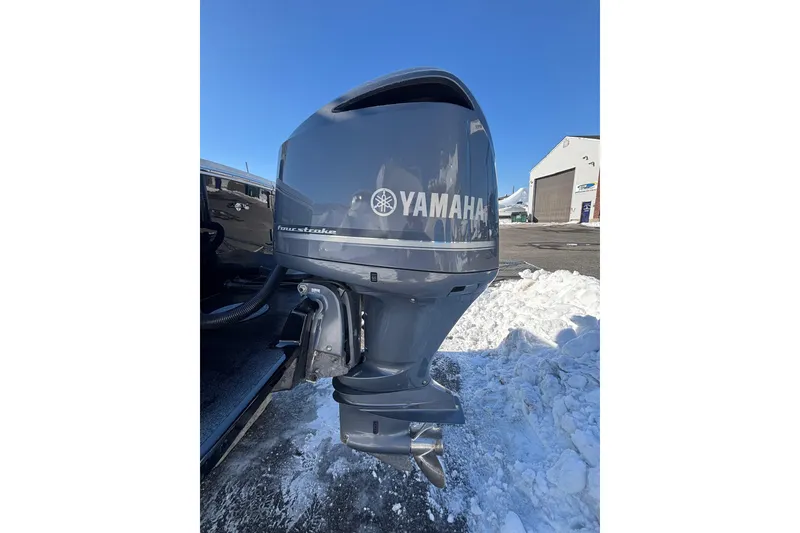 Slide: The Image of 2011 Regulator 28 Forward Seating with Yamaha outboard motor in snowy setting. - 9