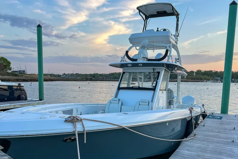 Slide: The Image of 2017 Everglades 355 Center Console boat docked at sunset. - 5