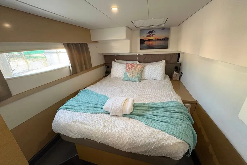 Slide: The Image of Luxurious cabin interior of 2015 Fountaine Pajot SABA 50 catamaran with cozy bed and decor. - 10