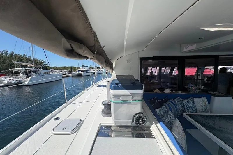Slide: The Image of 2015 Fountaine Pajot SABA 50 yacht deck with seating and marina view. - 13