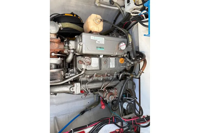 Slide: The Image of Engine compartment of a 2015 Fountaine Pajot SABA 50 catamaran, showcasing mechanical components. - 24