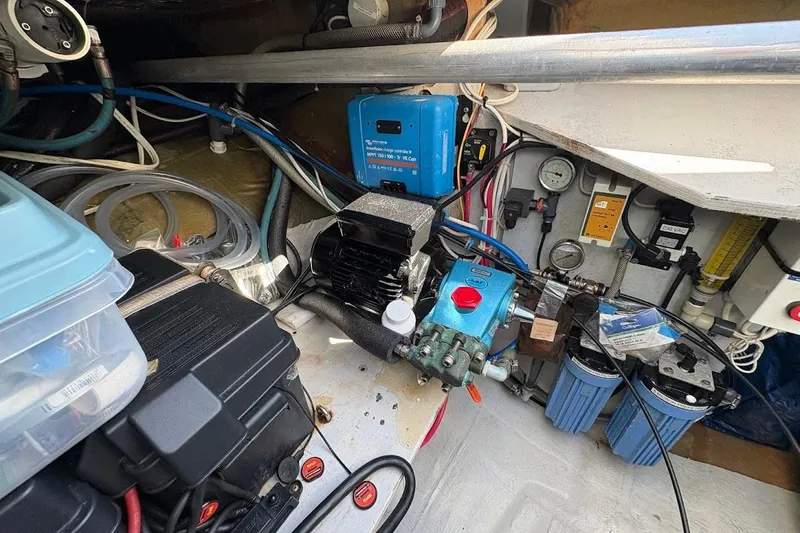 Slide: The Image of Engine room of 2015 Fountaine Pajot SABA 50 catamaran with various mechanical components. - 26