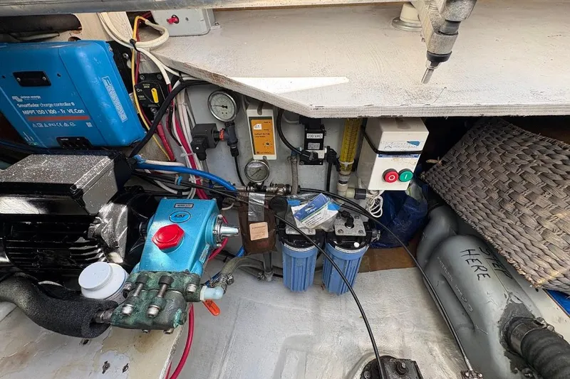 Slide: The Image of Engine room of 2015 Fountaine Pajot SABA 50 catamaran with various mechanical components. - 27