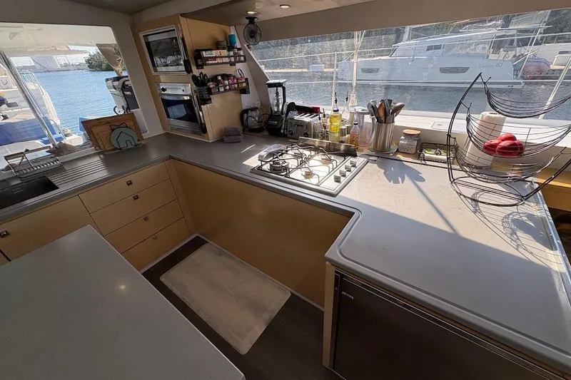 Slide: The Image of Modern kitchen interior of 2015 Fountaine Pajot SABA 50 yacht with appliances and sea view. - 4