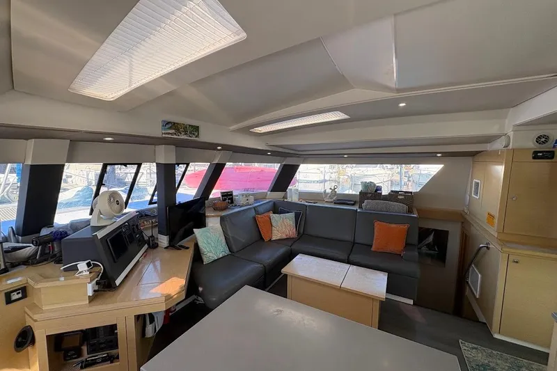 Slide: The Image of Luxurious interior of 2015 Fountaine Pajot SABA 50 catamaran with modern seating and navigation area. - 6