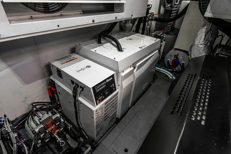 Slide: The Image of Engine room of 2022 Absolute 64 Navetta with Cummins Onan generator. - 112